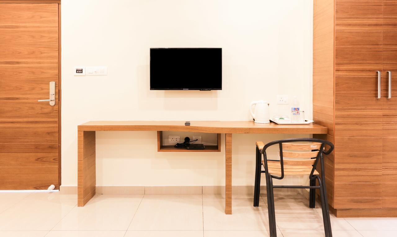 Treebo Trend Cmks Gulmohar Suites Kochi Exterior photo